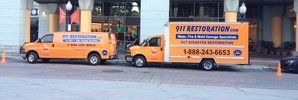 Water and Mold Damage Remediation Vehicles On Job Site