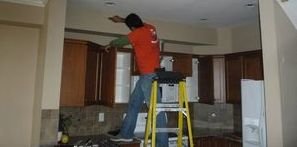 Water damage Chester Technician performing ceiling work